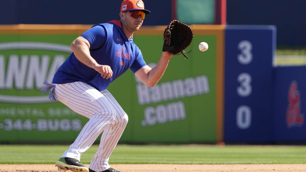 New York Mets infielder Pete Alonso handles a grounder during a spring training baseball practice Monday, Feb. 17, 2025, in Port St. Lucie, Fla.