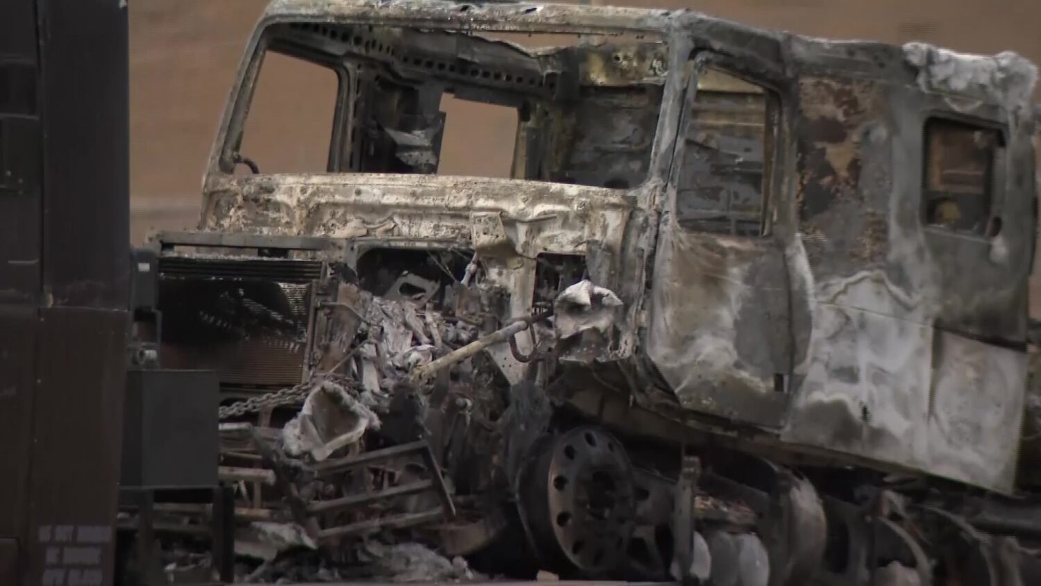 A burned truck is carried out of the Green River Tunnel in Green River, Wyo., on Monday.