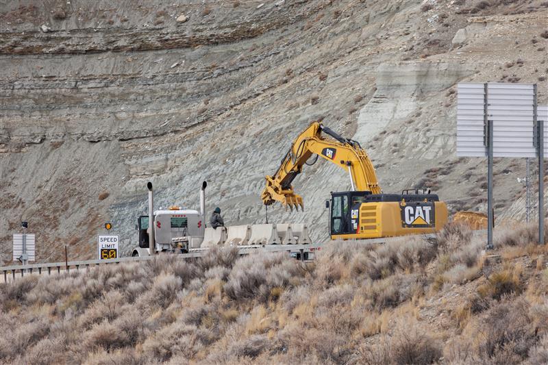 WYDOT crews place barriers next to the Green River Tunnel in Green River, Wyo., on Monday following a fatal crash in the tunnel on Friday.