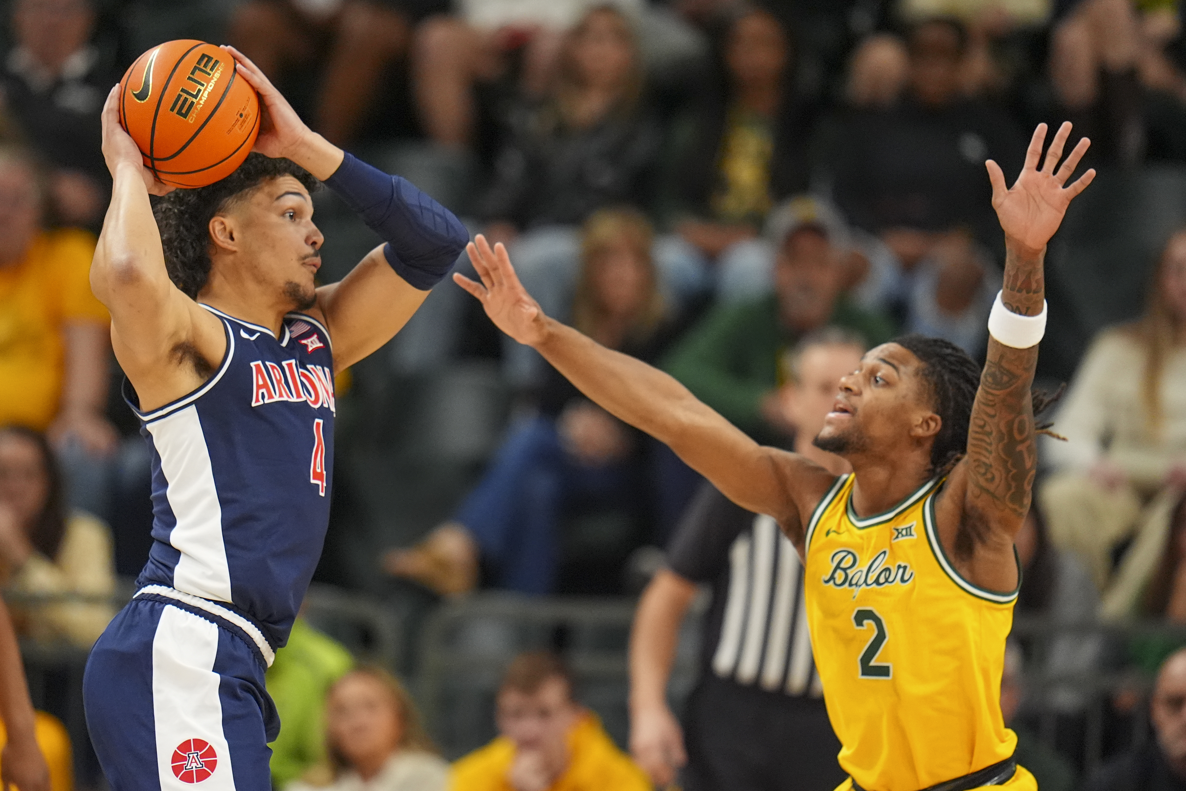 Arizona forward Trey Townsend (4) works the floor against Baylor guard Jayden Nunn (2) during the first half of an NCAA college basketball game Monday, Feb. 17, 2025, in Waco, Texas.