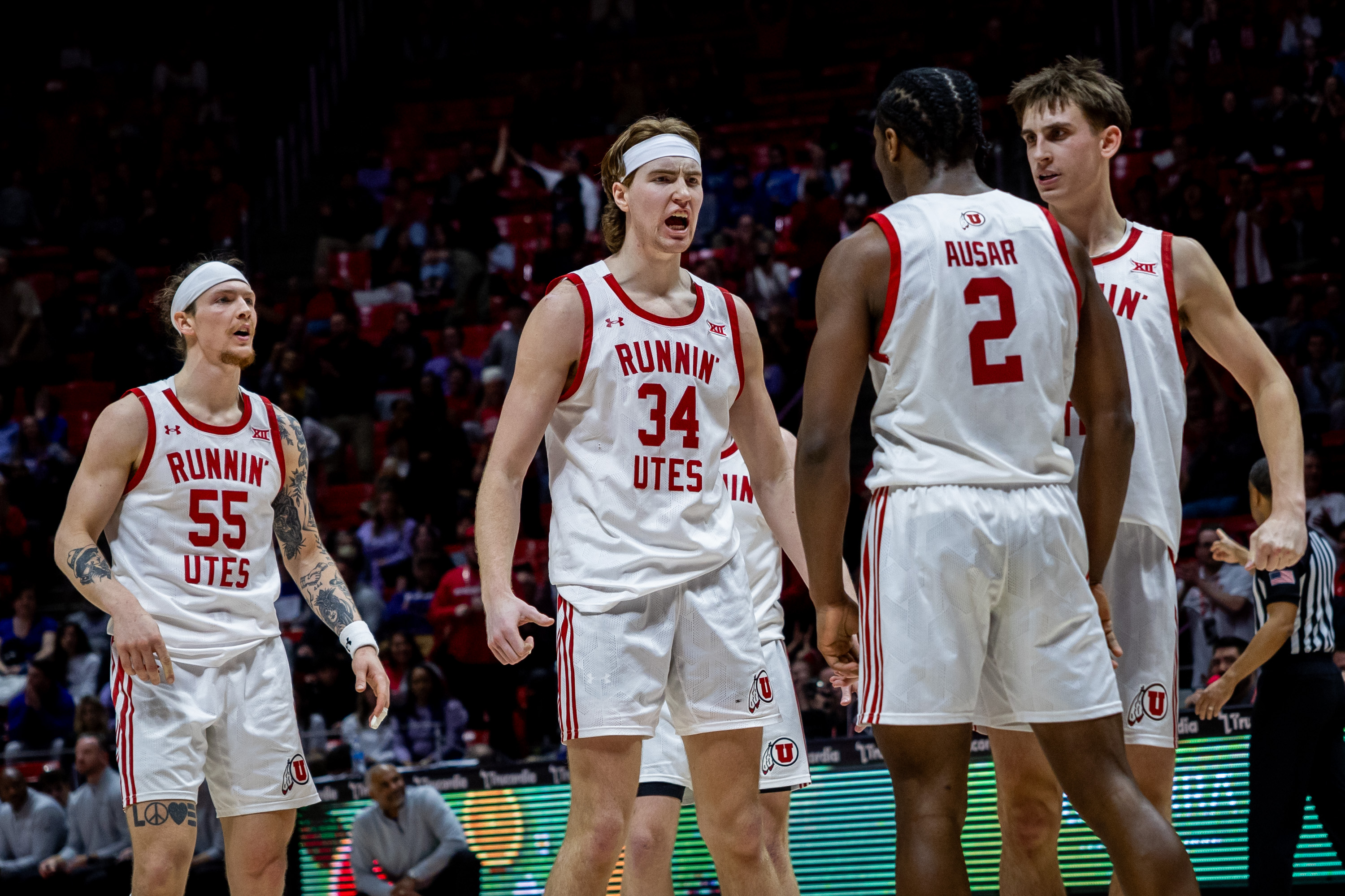 Utah Utes center Lawson Lovering (34) celebrates with teammates during a basketball game at Jon M. Huntsman Center in Salt Lake City on Monday, Feb. 17, 2025. The Utah Utes won 74-69 against the Kansas State Wildcats.