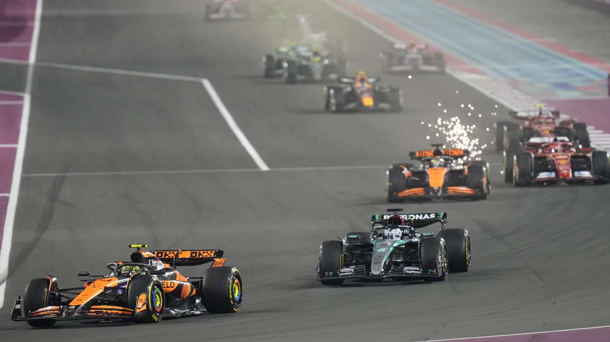 FILE -McLaren driver Lando Norris of Britain, left, in action during the Qatar Formula One Grand Prix at the Lusail International Circuit in Lusail, Qatar, Dec. 1, 2024. , File)