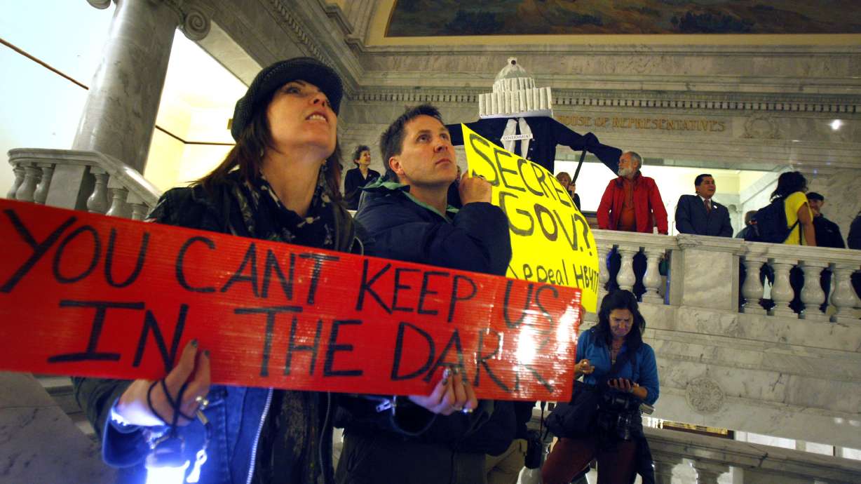 Brother and sister Allan and Lisa Versteeg join protesters March 10, 2011 at the Utah State Capitol for "Shine the Light on Government" Rally to repeal HB477. The future of Utah public records laws is uncertain after ongoing legislative action.