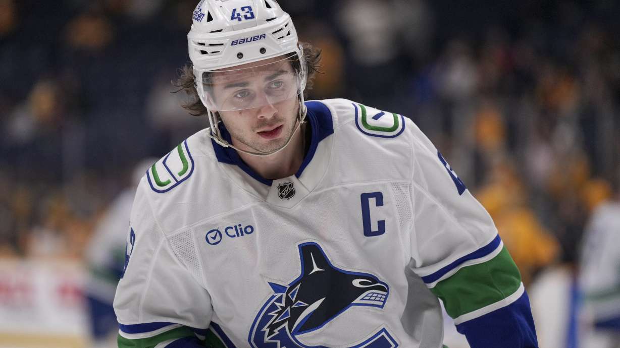 Vancouver Canucks defenseman Quinn Hughes (43) warms up for the team's NHL hockey game against the Nashville Predators, Wednesday, Jan. 29, 2025, in Nashville, Tenn.