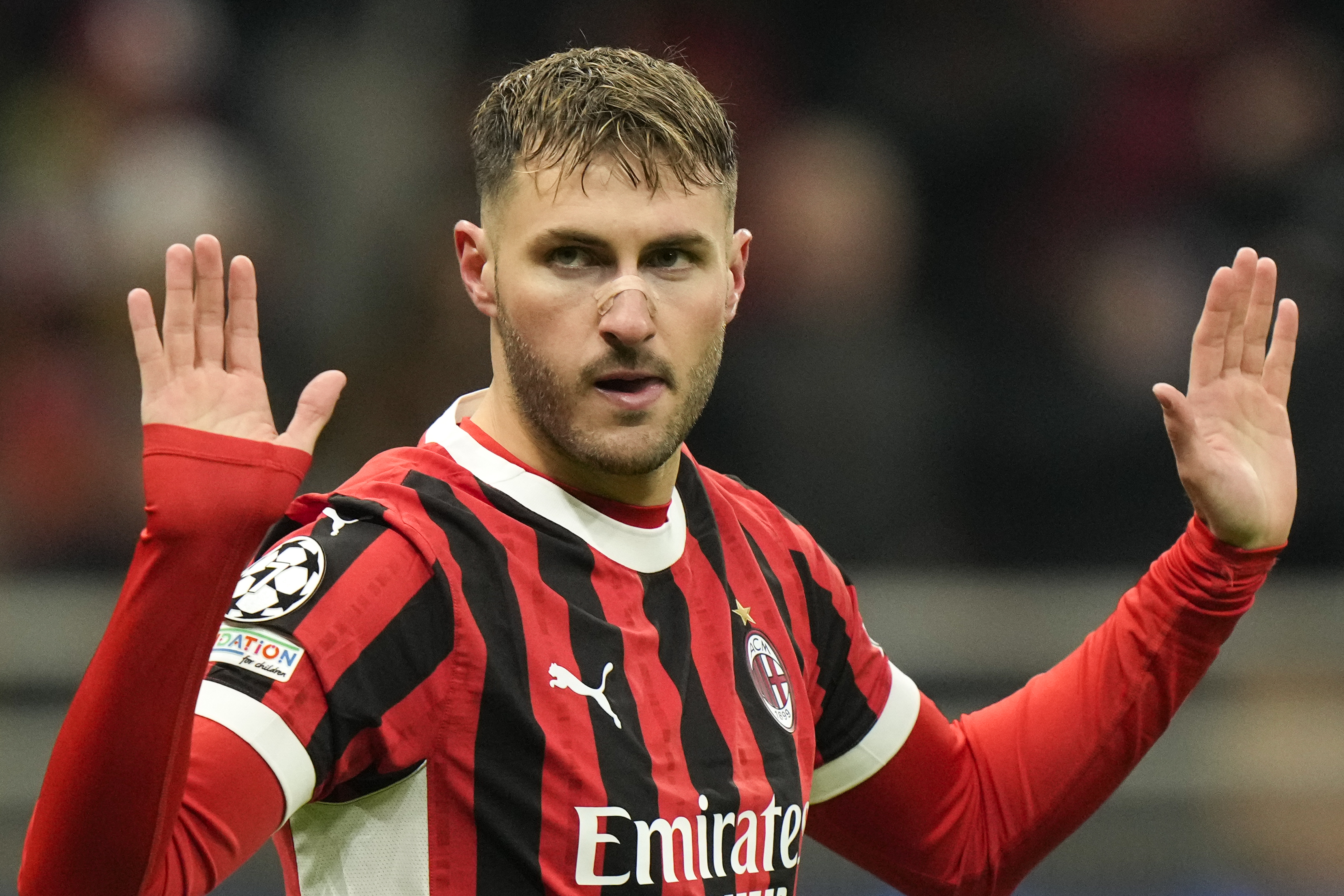 AC Milan's Santiago Gimenez celebrates after scoring his side's first goal during Champions League, playoff second leg soccer match between AC Milan and Feyenoord, at the San Siro stadium in Milan, Italy, Tuesday, Feb.18, 2025.