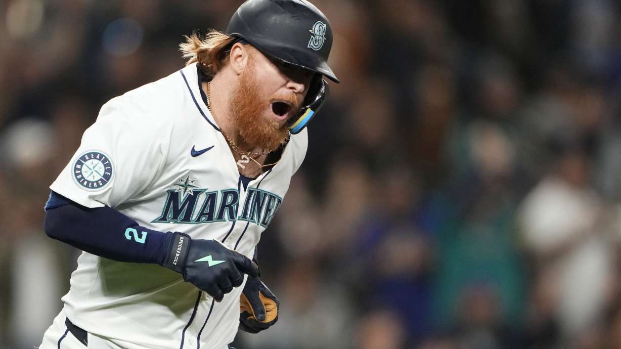 FILE - Seattle Mariners' Justin Turner reacts to hitting a solo home run against the New York Yankees during the eighth inning of a baseball game Wednesday, Sept. 18, 2024, in Seattle.