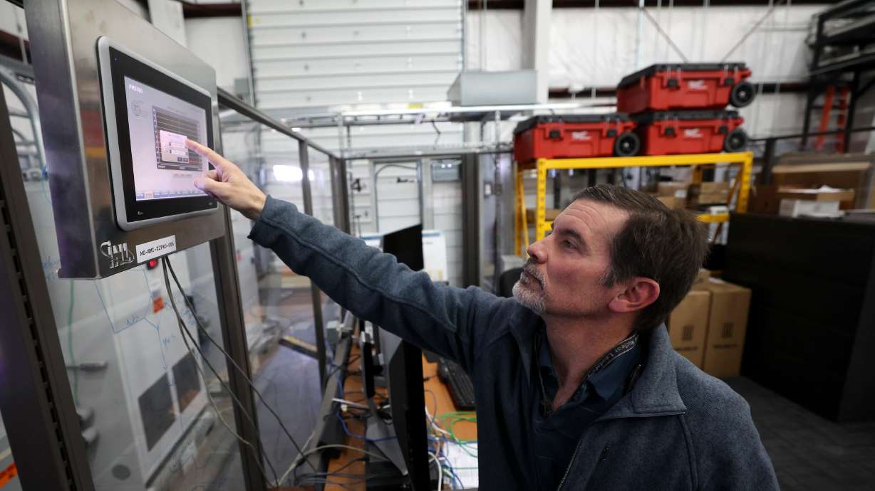 Kurt Myers, Idaho National Laboratory distributed energy and grid systems integration group lead, works in the Microgrid Research Laboratory in the INL Energy Systems Laboratory in Idaho Falls on April 5, 2023.