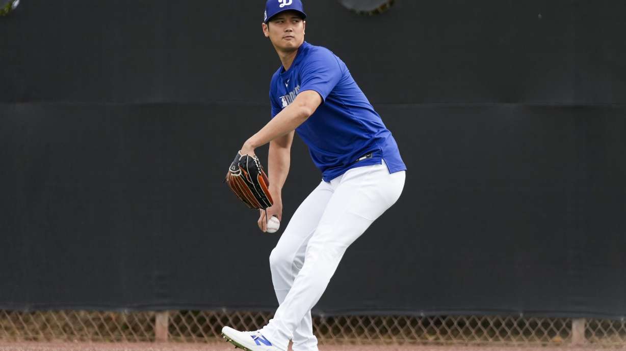 Los Angeles Dodgers two-way player Shohei Ohtani works out during spring training baseball practice, Monday, Feb. 17, 2025, in Phoenix.