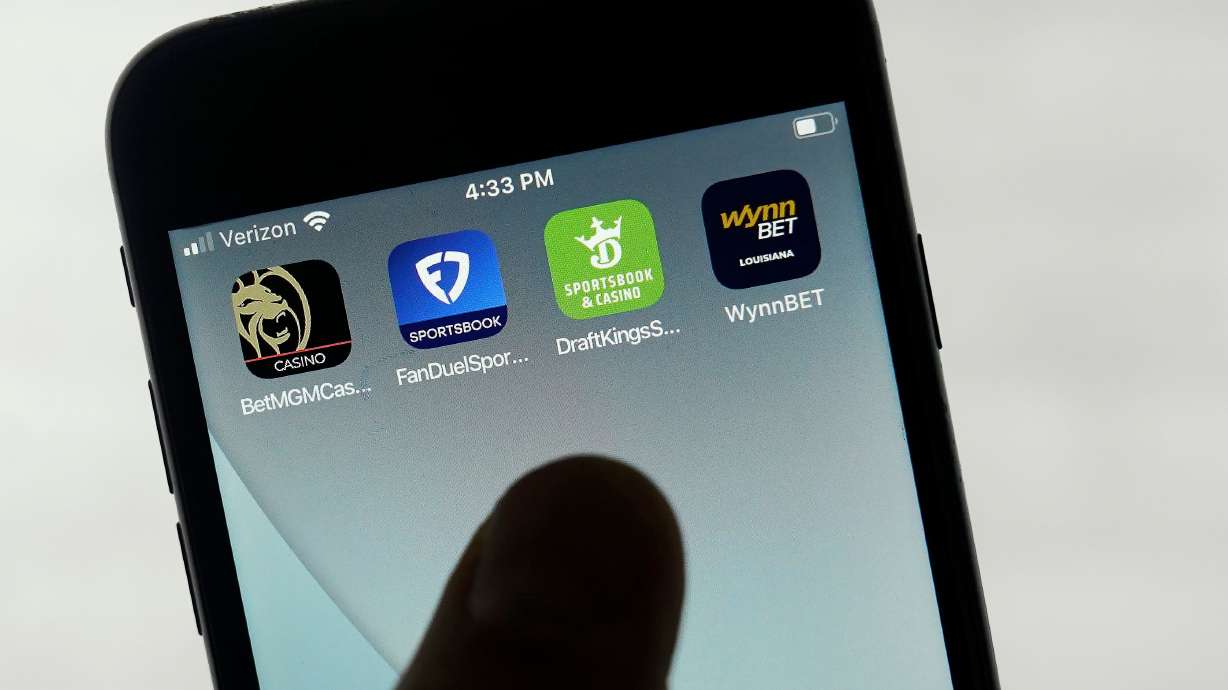 FanDuel, DraftKings and other online gambling apps are displayed on a phone in San Francisco, Sept. 26, 2022. As sports betting has surged, so has the number of people seeking a way out of a gambling addiction, according to a new study.