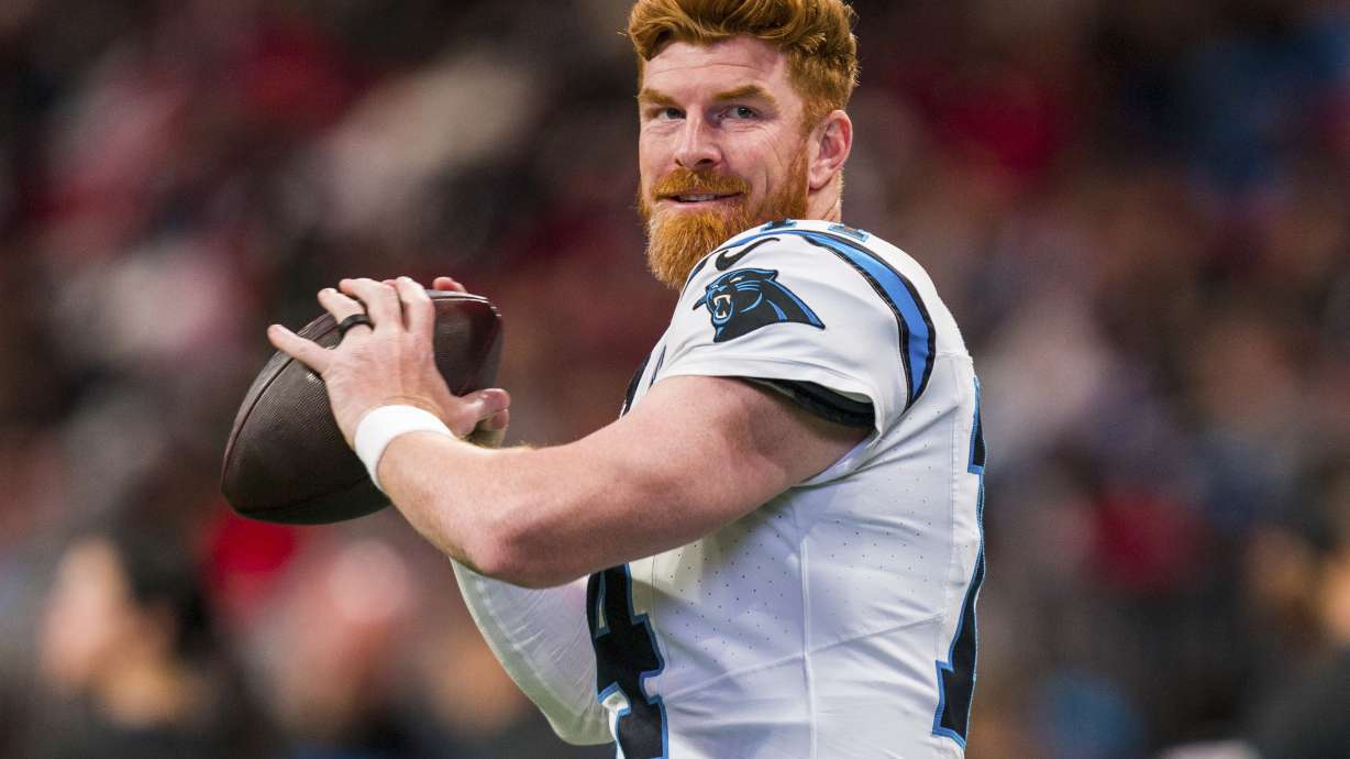 FILE - Carolina Panthers quarterback Andy Dalton (14) warms up during the first half of an NFL football game against the Atlanta Falcons, Sunday, Jan. 5, 2025, in Atlanta.