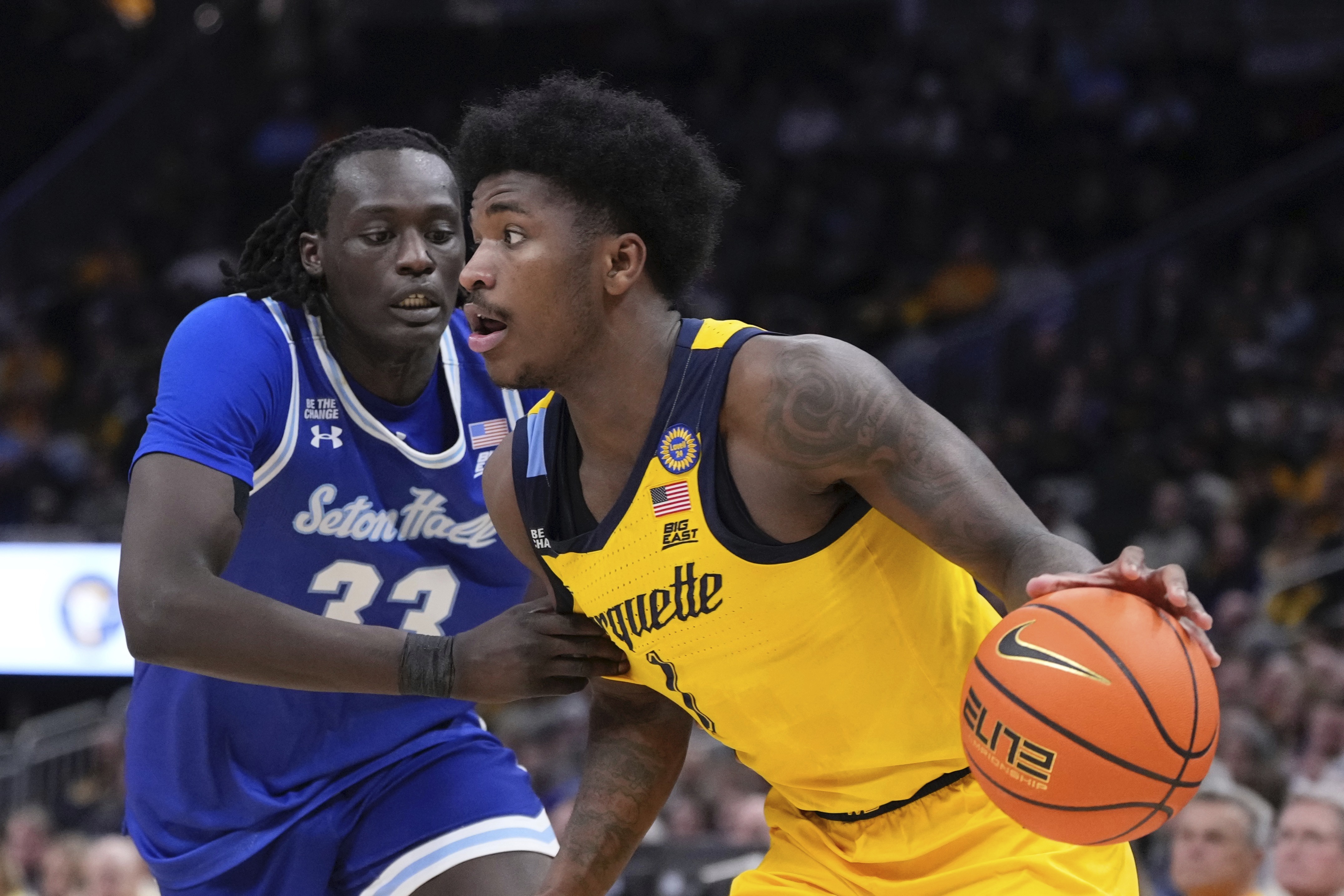 Marquette's Kam Jones gets past Seton Hall's Garwey Dual during the first half of an NCAA college basketball game Tuesday, Feb. 18, 2025, in Milwaukee.