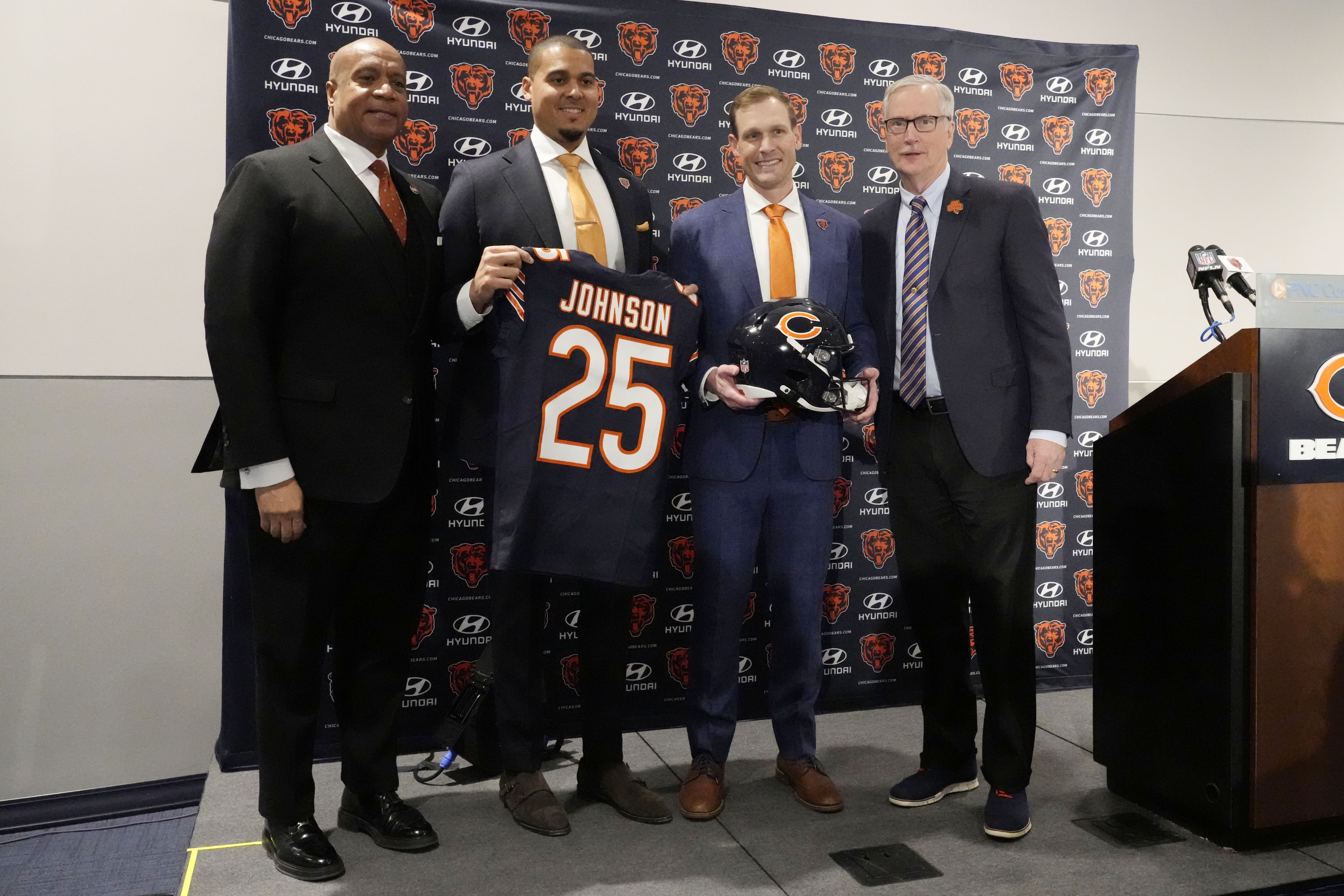 Chicago Bears President and CEO Kevin Warren, left, general manager Ryan Poles, second from left, new head coach Ben Johnson and team owner George McCaskey, right, pose for photo during an NFL football news conference at Halas Hall in Lake Forest, Ill., Wednesday, Jan. 22, 2025.