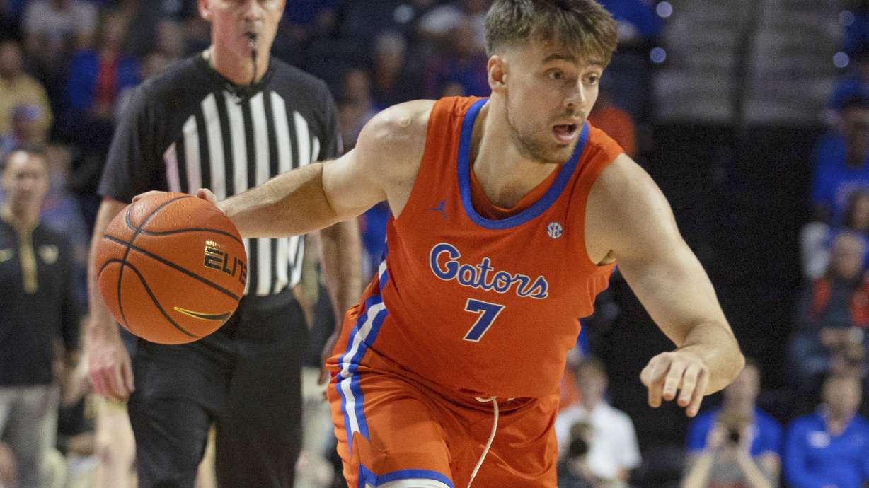 FILE - Florida guard Urban Klavzar (7) drives during the second half of an NCAA college basketball game against Vanderbilt, Tuesday, Feb. 4, 2025, in Gainesville, Fla.