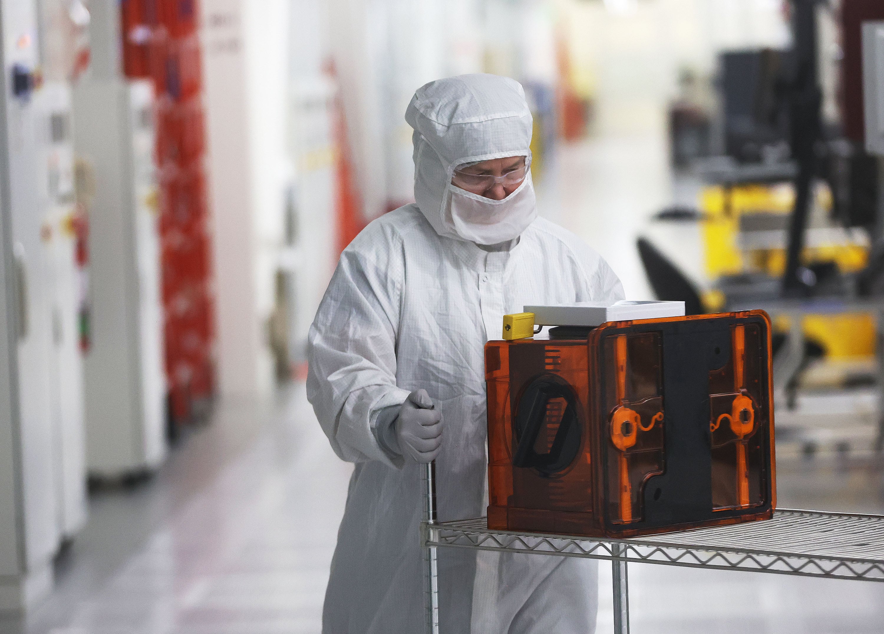 A worker at Texas Instruments' plant in Lehi on Dec. 14, 2022. President Donald Trump said new sector-specific U.S. trade tariffs were in the works, including 25% levies on imported vehicles, pharmaceutical products and computer microchips.