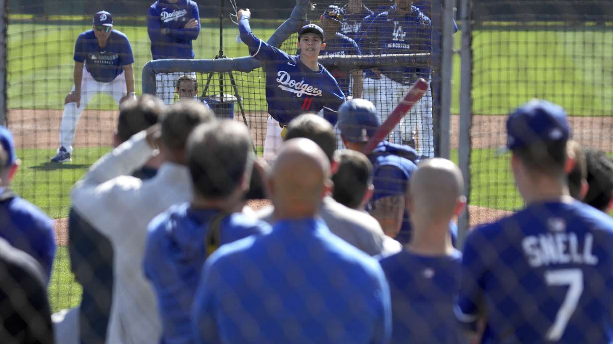 Los Angeles Dodgers pitcher Roki Sasaki (11) throws during spring training baseball practice, Wednesday, Feb. 19, 2025, in Phoenix.