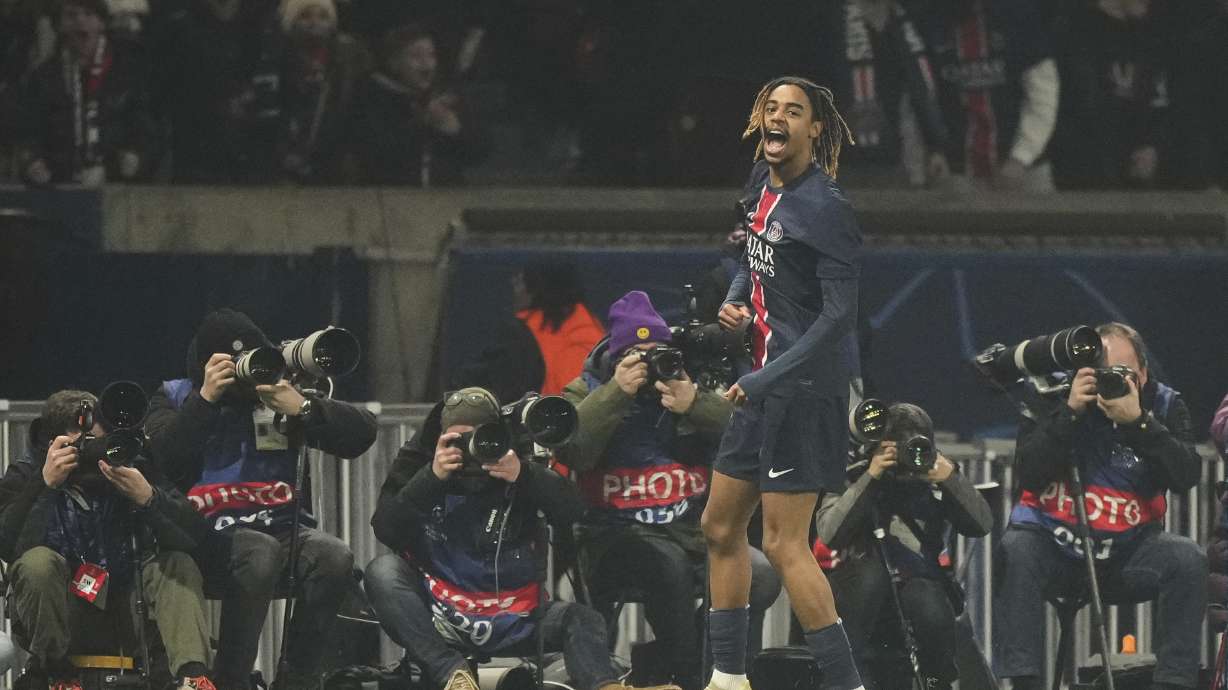 PSG's Bradley Barcola celebrates after scoring the opening goal of his team against Brest during the Champions League playoff second leg soccer match between Paris Saint-Germain and Brest at the Parc des Princes in Paris, Wednesday, Feb. 19, 2025.