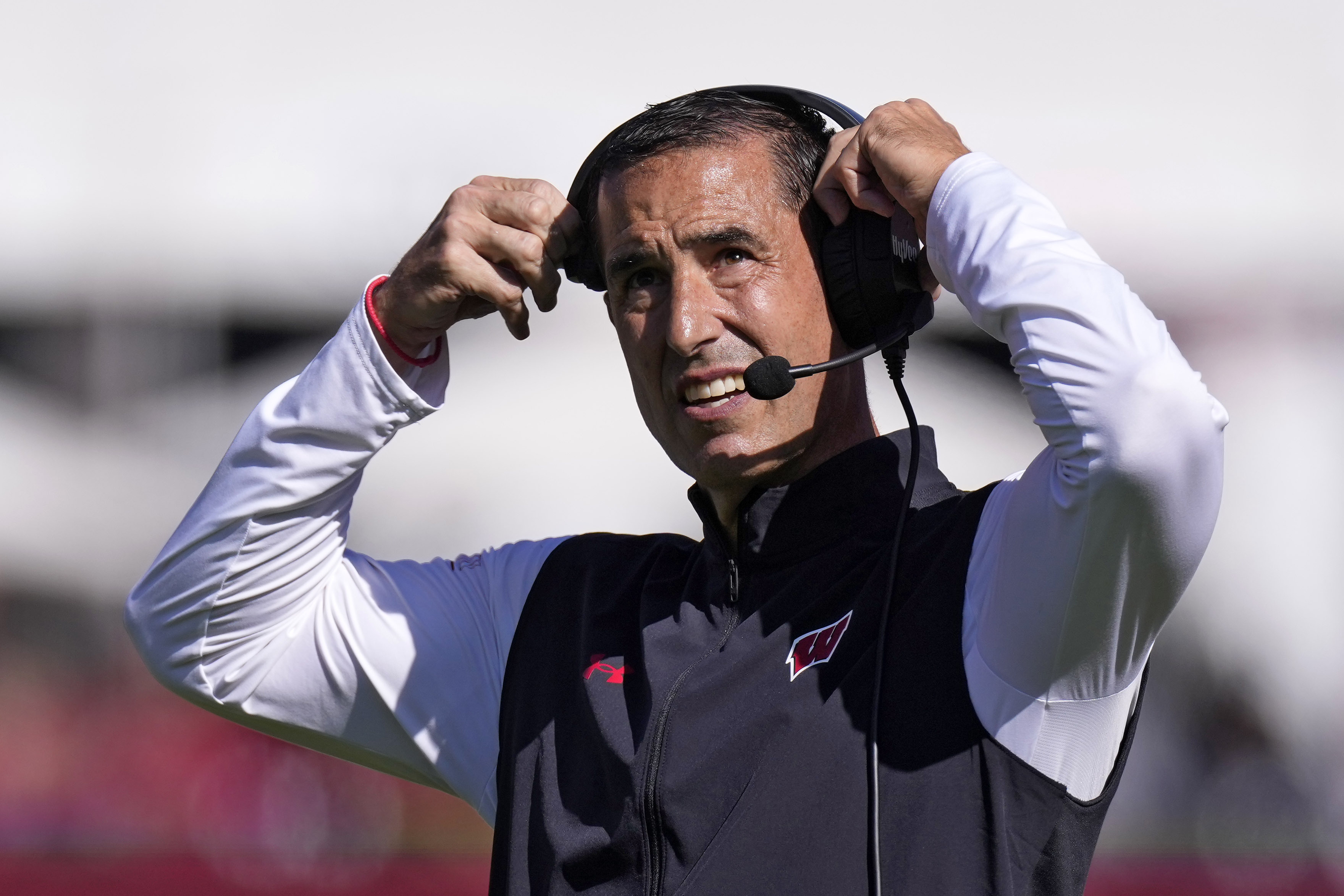 FILE - Wisconsin head coach Luke Fickell adjusts his headset during the second half of an NCAA college football game against Southern California, Saturday, Sept. 28, 2024, in Los Angeles. 