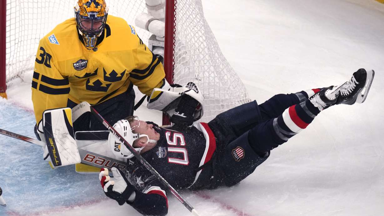United States' Brady Tkachuk slams into the post while chasing the puck towards Sweden goaltender Samuel Ersson during the first period of a 4 Nations Face-Off hockey game, Monday, Feb. 17, 2025, in Boston.