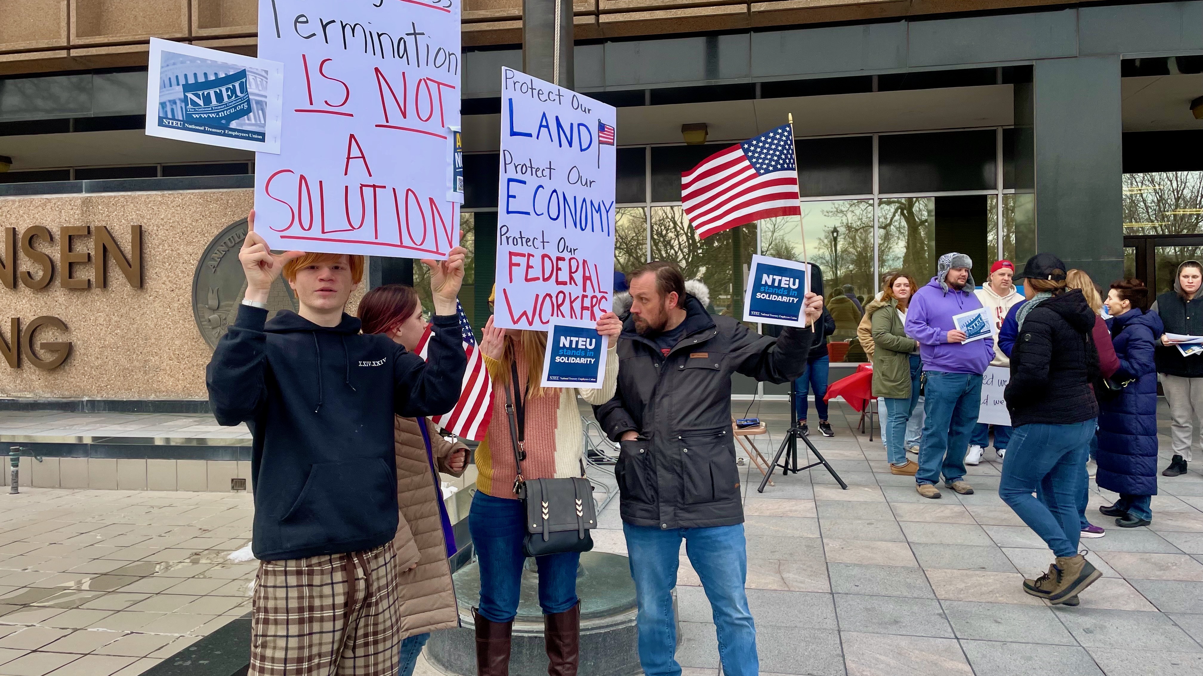 Participants in a demonstration on Wednesday in Ogden called by a union representing some of the city's IRS workers in light of planned firings.