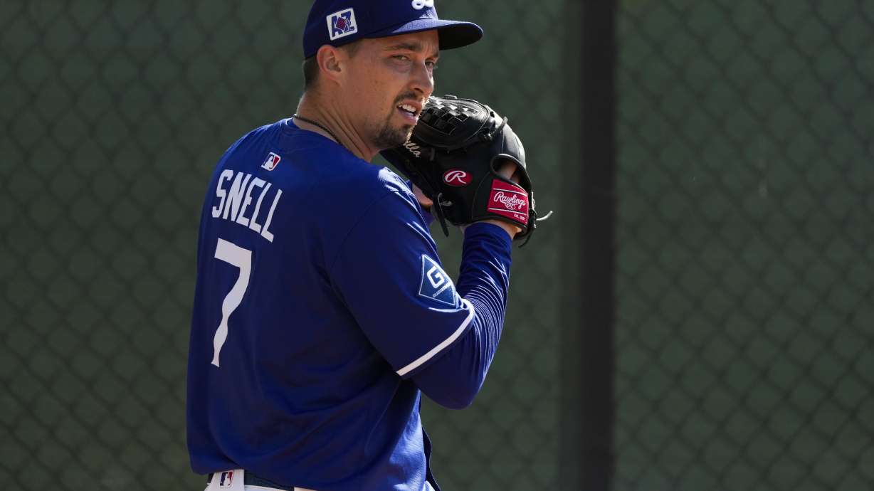 Los Angeles Dodgers pitcher Blake Snell throws during spring training baseball practice, Tuesday, Feb. 18, 2025, in Phoenix.