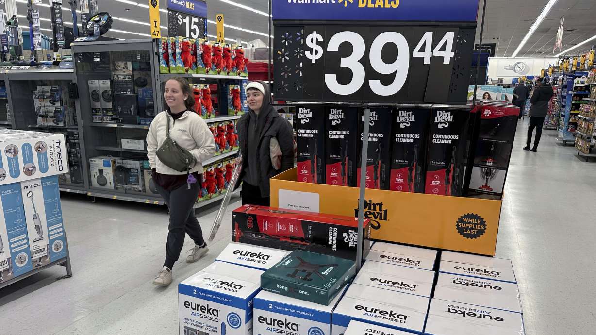 People shop for Black Friday deals at a Walmart store in Rochester, N.Y., Nov. 29, 2024. Walmart delivered another year of strong sales and profits, but this year appears to come with new challenges.