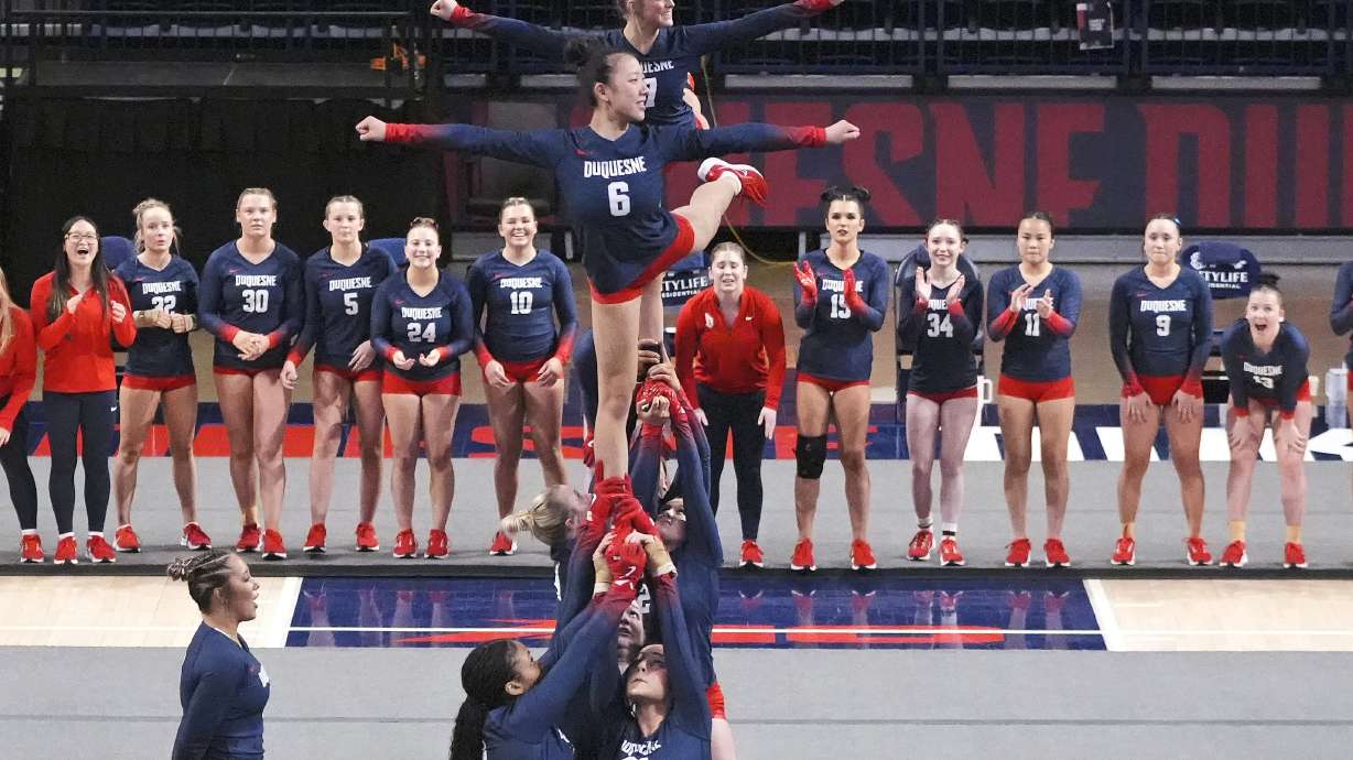 Duquesne's Michela Del Rosso (6) and Sienna Johnson (7) compete in the team's inaugural acrobatics and tumbling meet against Gannon University, Friday, Feb. 7, 2025, at the Cooper Fieldhouse on the Duquesne University campus in Pittsburgh.