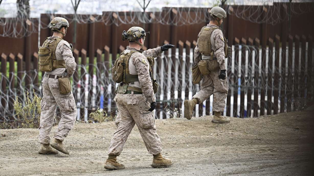 U.S. Marines deploy along the U.S.-Mexico border near the San Ysidro Port of Entry, Feb. 7, in San Diego. Immigrant encounters by U.S. officials at the U.S.-Mexico border dipped in January to the lowest level since late 2021.