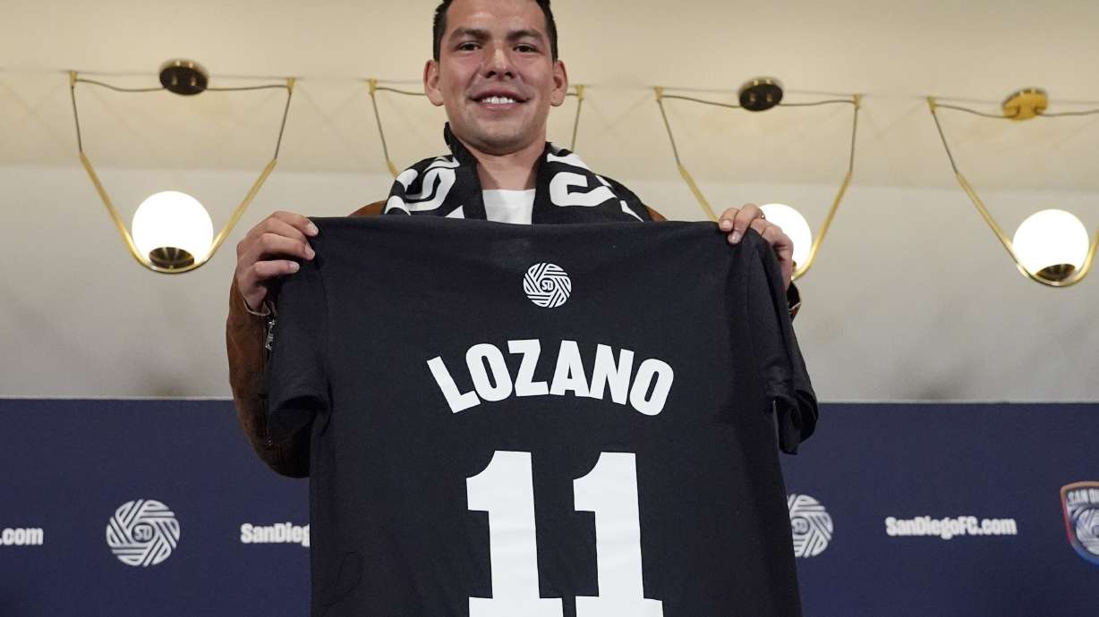 FILE - Hirving "Chucky" Lozano poses with his new San Diego FC jersey during an introductory news conference for the new MLS soccer team Thursday, June 13, 2024, in San Diego.