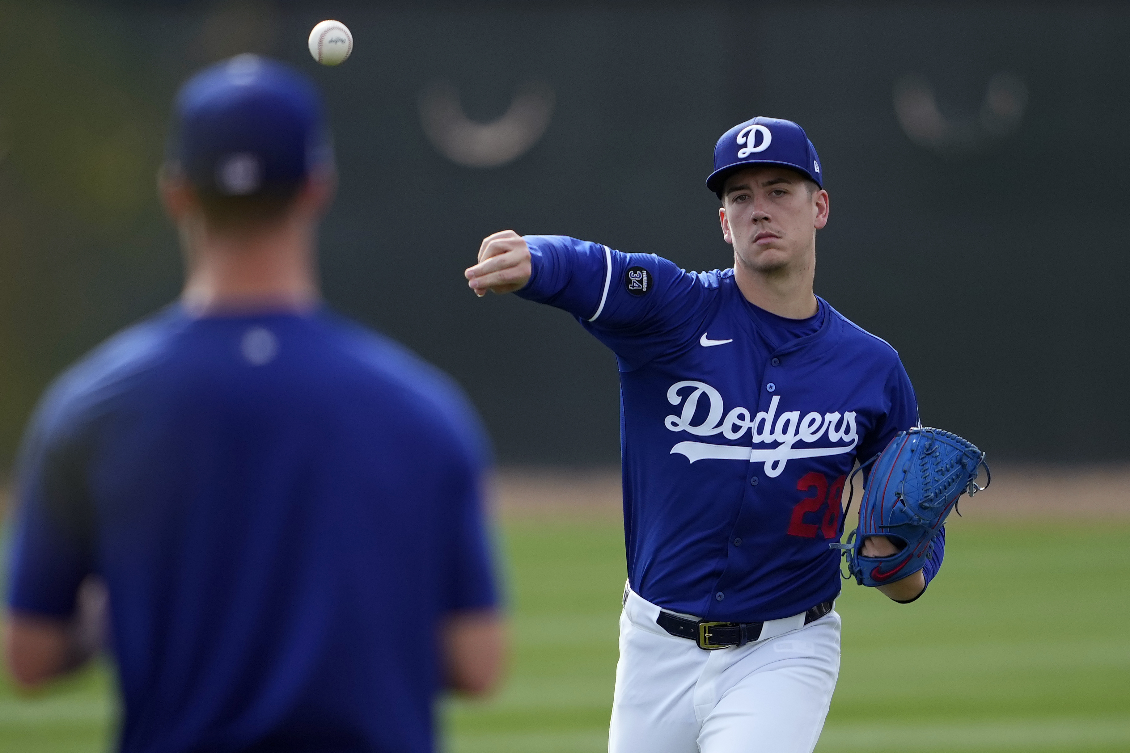 Los Angeles Dodgers' Bobby Miller throws during a baseball spring training workout, Thursday, Feb. 13, 2025, in Phoenix. 