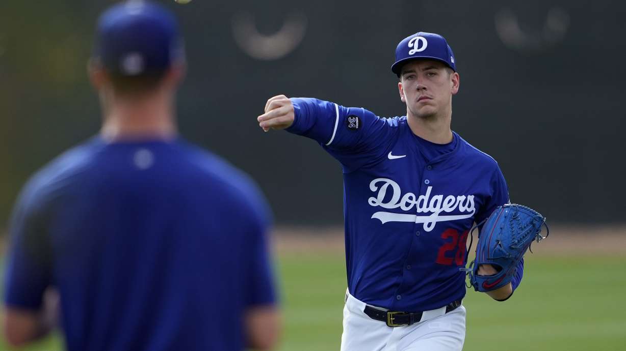 Los Angeles Dodgers' Bobby Miller throws during a baseball spring training workout, Thursday, Feb. 13, 2025, in Phoenix.