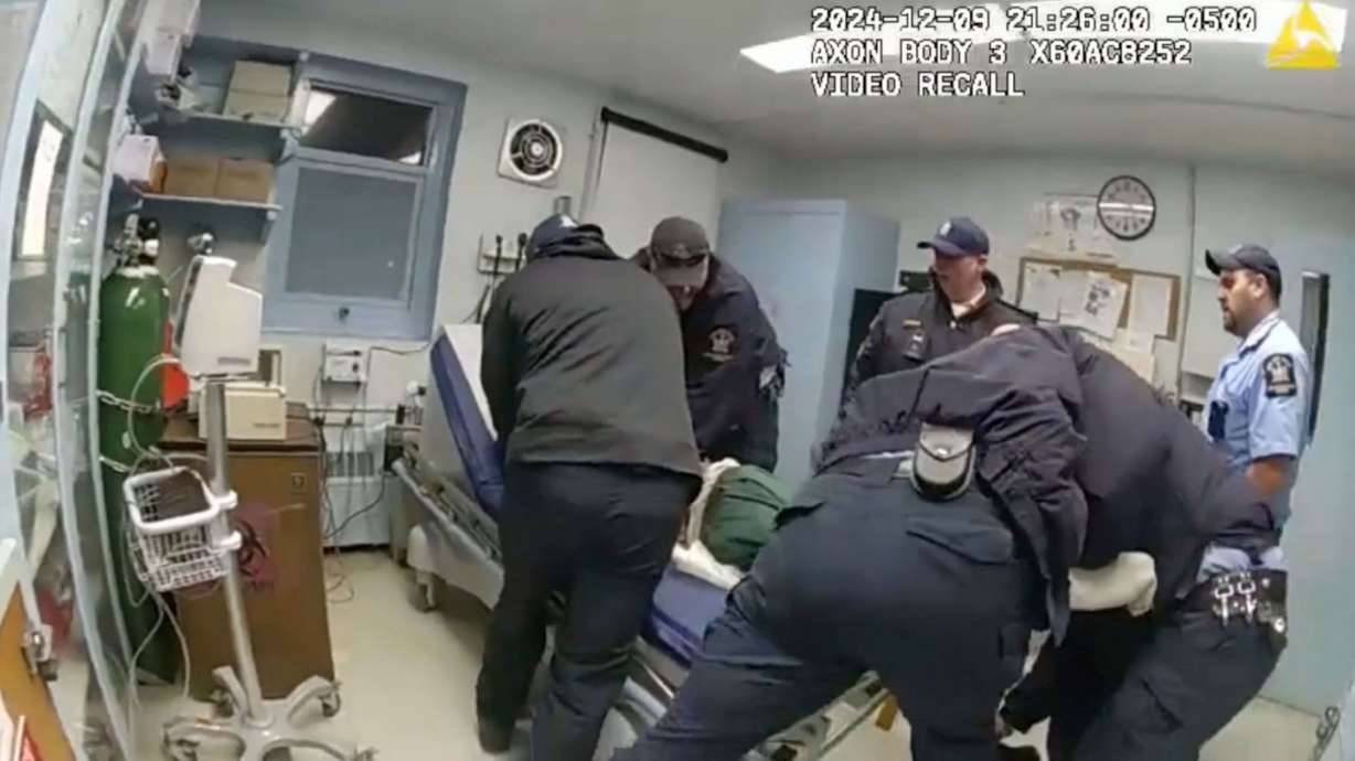 Robert Brooks is restrained by correctional officers at the Marcy Correctional Facility. Six prison workers in New York were indicted on murder charges on Thursday in connection with the death of Brooks.