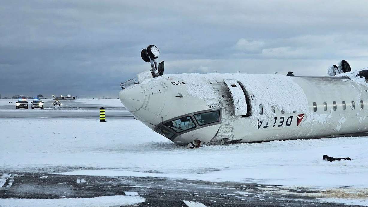 The wreckage of a Delta Air Lines jet on Feb. 18 after it burst into flames and flipped upside down at Toronto Pearson International Airport in Mississauga, Ontario.