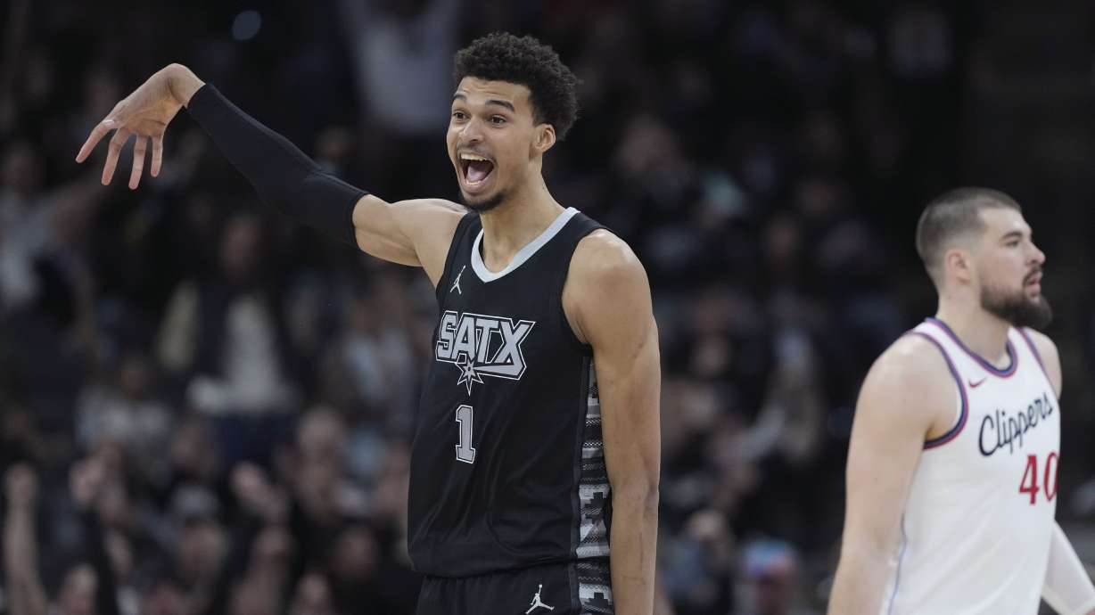 San Antonio Spurs center Victor Wembanyama (1) reacts to a score against the LA Clippers during the second half of an NBA basketball game in San Antonio, Wednesday, Jan. 29, 2025.