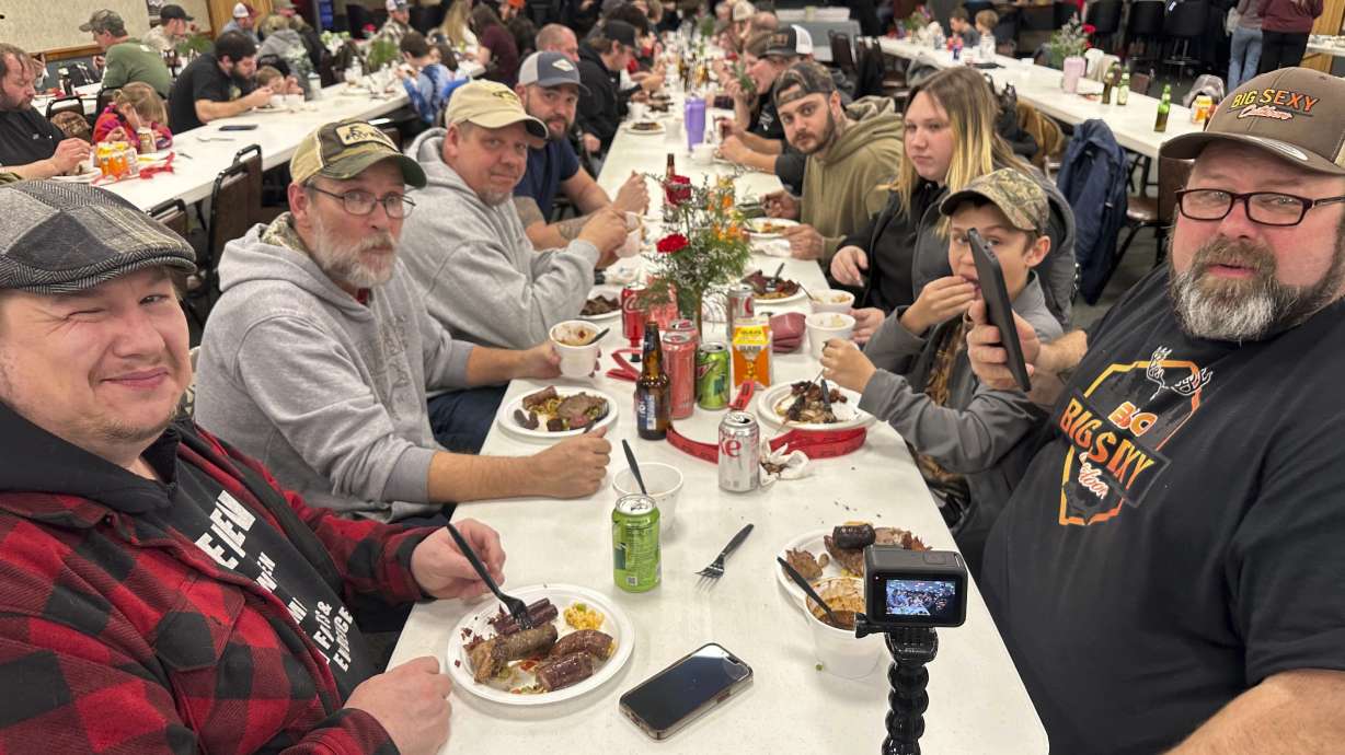 Diners enjoy a wild game dinner that included boar, bobcat and coyote in Pine Grove, Pa.,, on Saturday, Feb. 15, 2025.