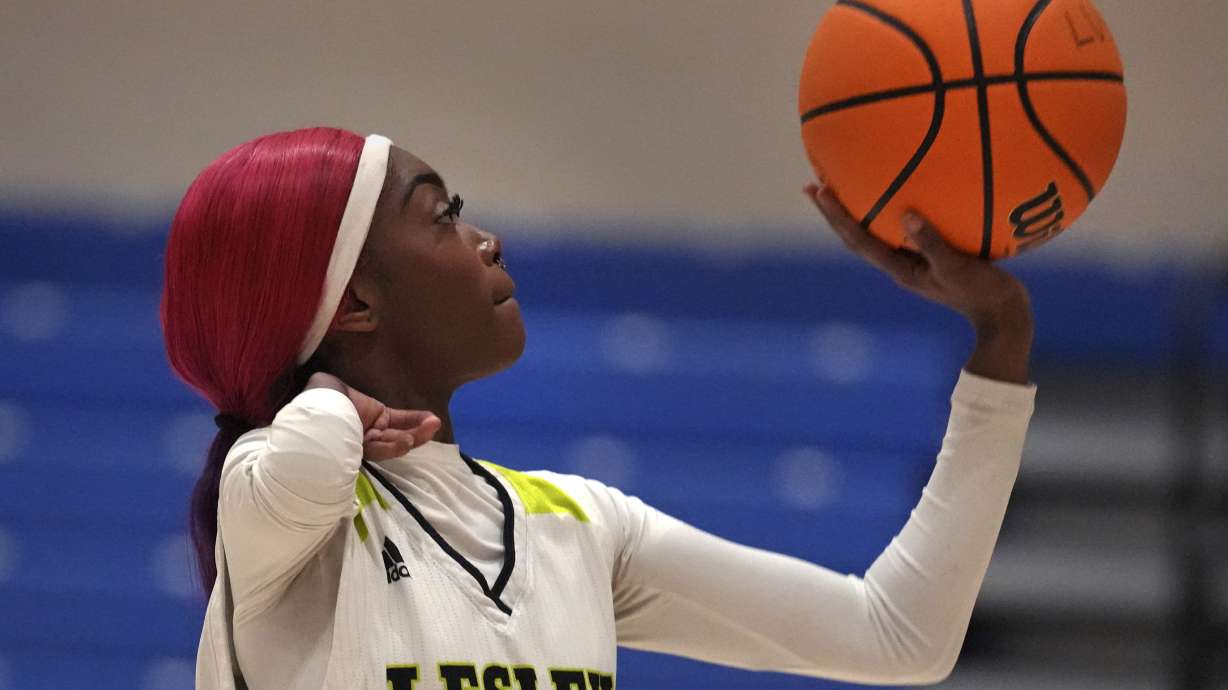 Lesley College basketball player Baileigh Sinaman-Daniel lines up a foul shot while practicing prior to game, Tuesday, Feb. 11, 2025, in Lexington, Mass.