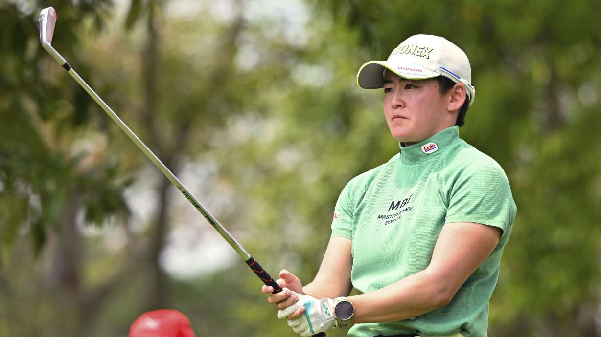 Akie Iwai of Japan prepares for her shot on the 16th hole during the first round of the LPGA Honda Thailand golf tournament in Pattaya, southern Thailand, Thursday, Feb. 20, 2025.