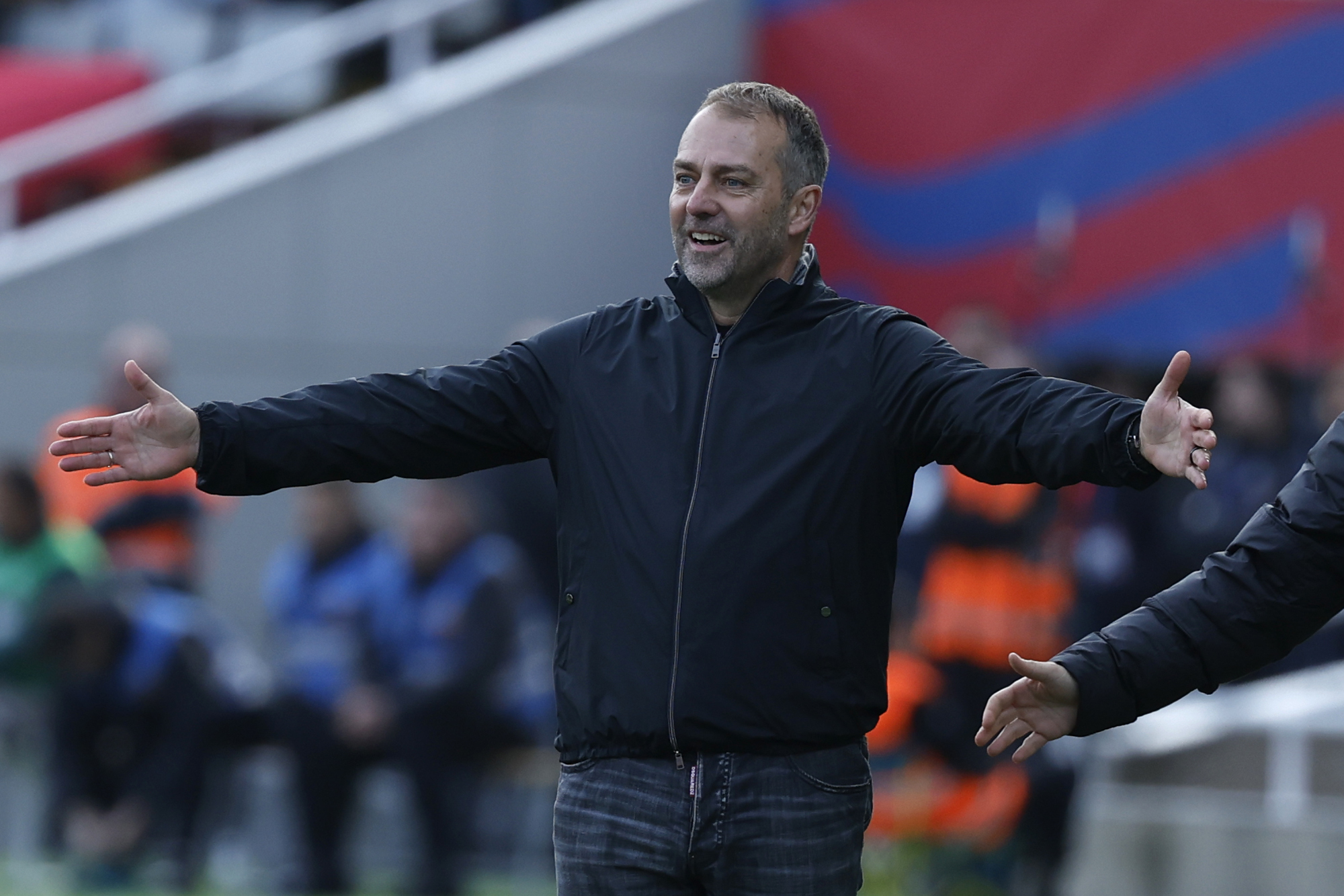 Barcelona's head coach Hansi Flick gestures during a Spanish La Liga soccer match between Barcelona and Alaves at the Lluis Companys Olympic Stadium in Barcelona, Spain, Sunday Feb. 2, 2025. 