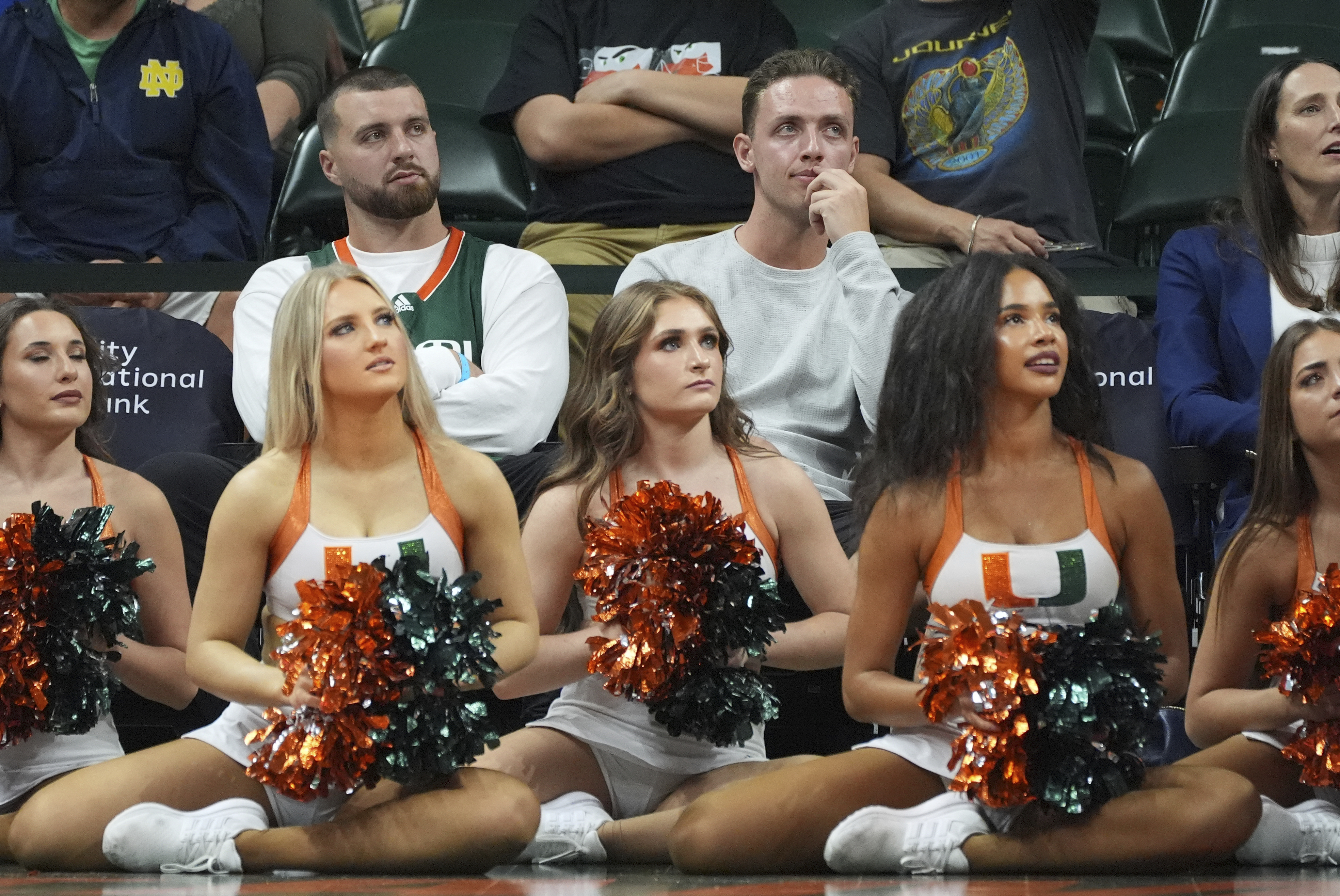 Miami football quarterback Carson Beck, top center, watches the first half of an NCAA college basketball game between Miami and Notre Dame, Thursday, Feb. 20, 2025, in Coral Gables, Fla. 