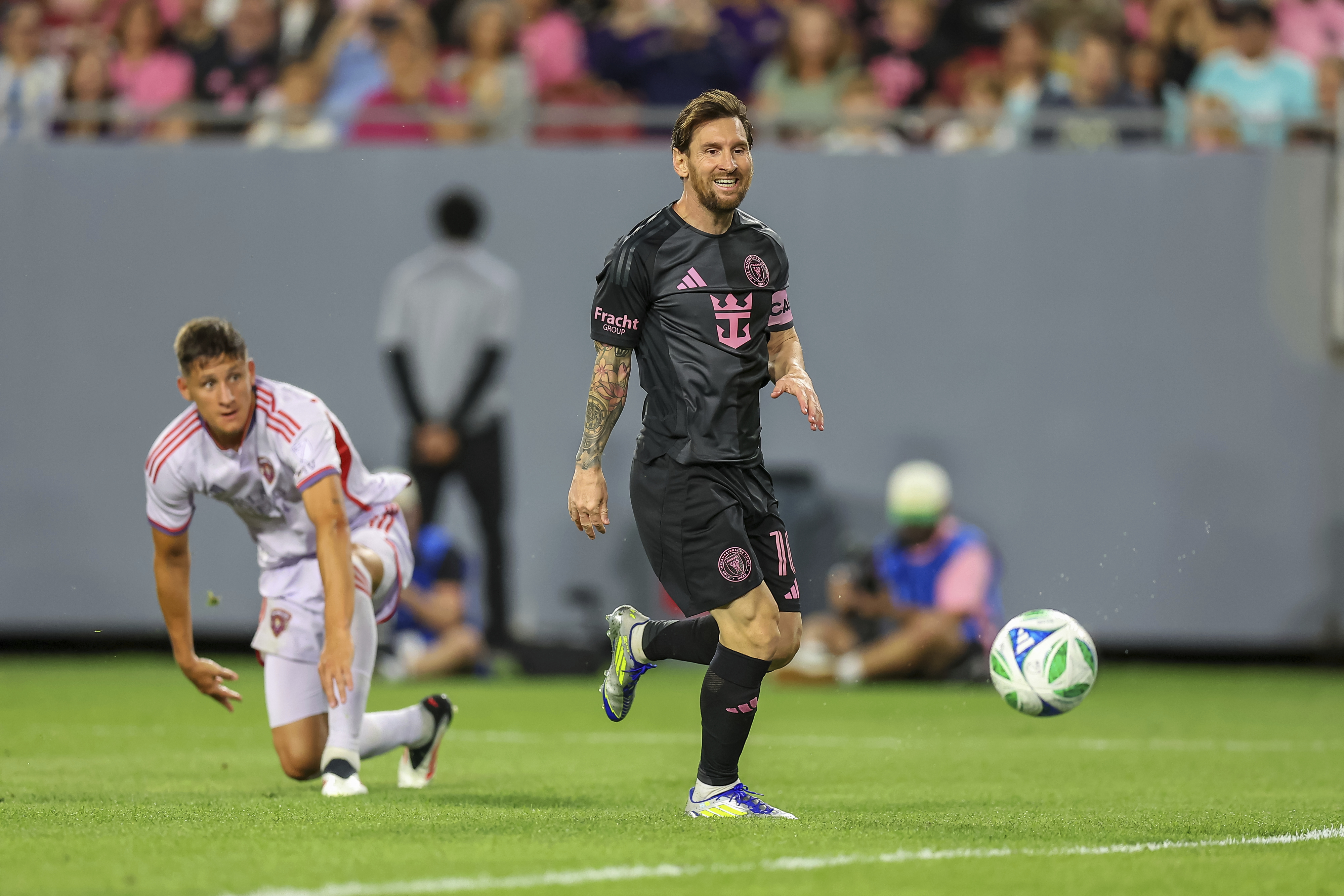 Lionel Messi of Inter Miami FC makes a pass during the second half of a preseason MLS soccer match against Orlando City on Friday, Feb. 14, 2025, in Tampa, Fla. 