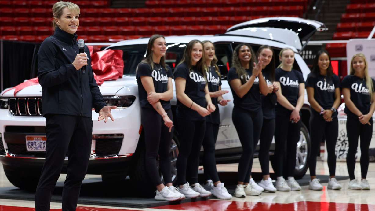 Utah gymnastics coach Carly Dockendorf speaks at the Huntsman Center in Salt Lake City on Dec. 13, 2023, as a vehicle lease deal was made available to some student athletes as part of a name, image and likeness package. A proposed law in Utah would hide direct payments made to college athletes from public view.