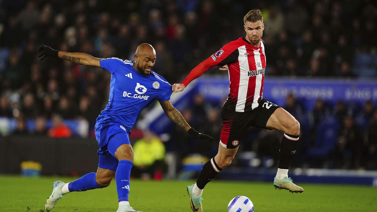 Leicester City's Jordan Ayew, left, and Brentford's Kristoffer Ajer battle for the ball during the English Premier League soccer match at the King Power Stadium, Leicester, England, Friday Feb. 21, 2025.