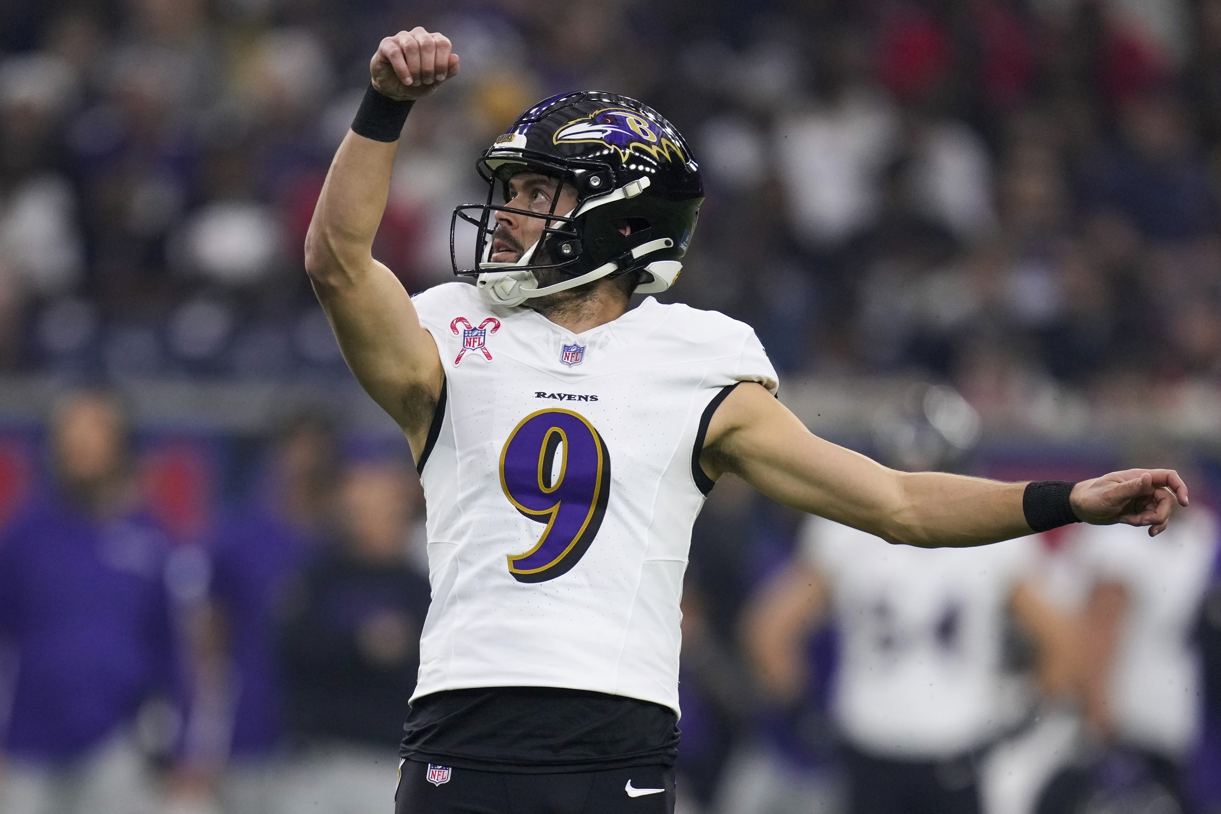 FILE - Baltimore Ravens place kicker Justin Tucker (9) watches his extra point against the Houston Texans during the first half of an NFL football game Wednesday, Dec. 25, 2024, in Houston. 