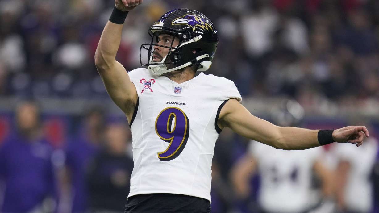 FILE - Baltimore Ravens place kicker Justin Tucker (9) watches his extra point against the Houston Texans during the first half of an NFL football game Wednesday, Dec. 25, 2024, in Houston.