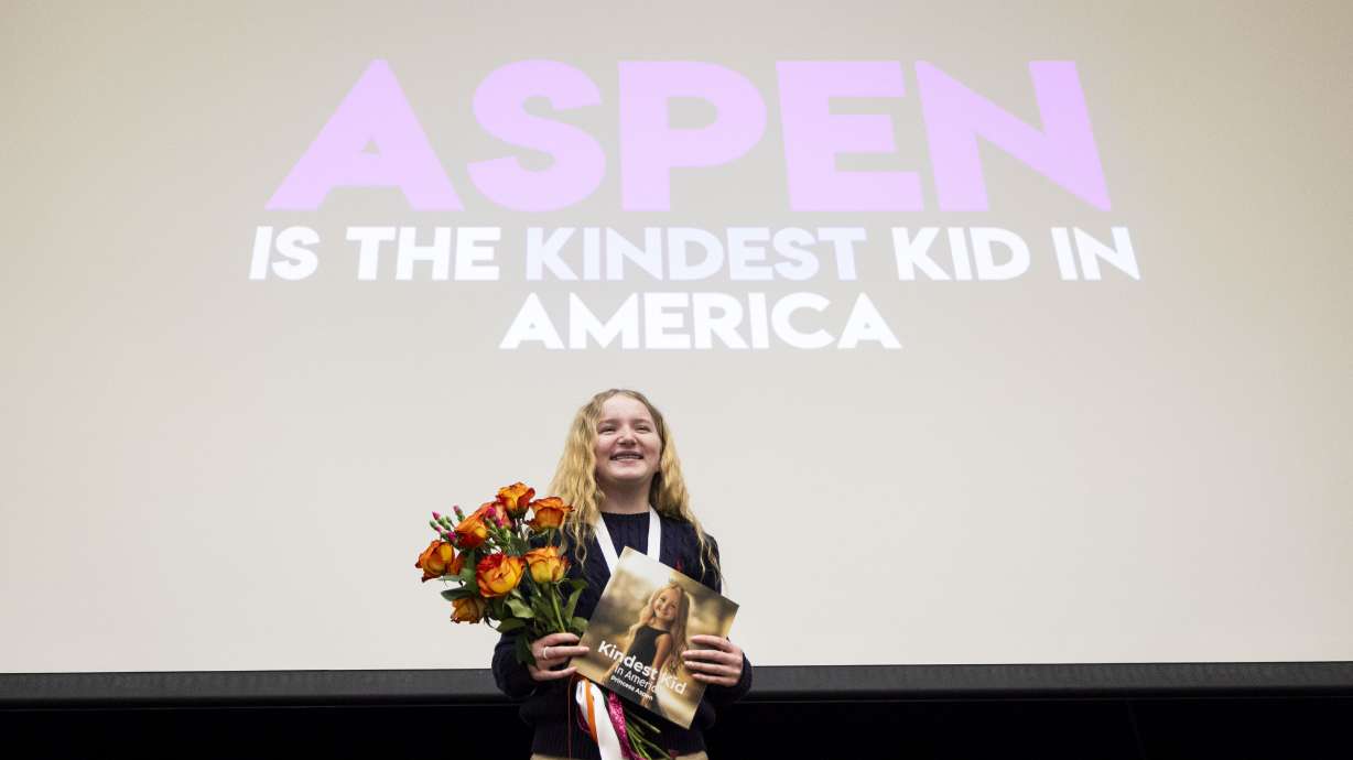 Sixth-grader Aspen Rowley, 12, poses for photos after an assembly presenting the Kindest Kid in America award to Rowley at Sage Hills Elementary School in Saratoga Springs on Friday, Feb. 21, 2025.