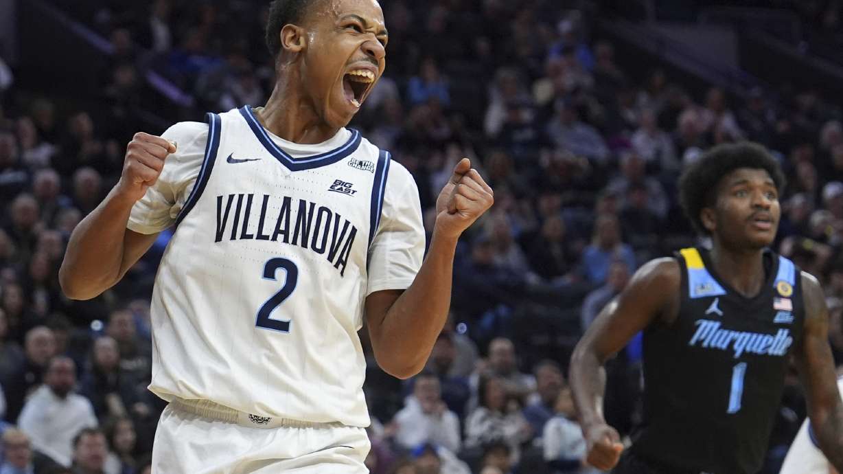 Villanova's Jhamir Brickus, left, reacts past Marquette's Kam Jones during the first half of an NCAA college basketball game, Friday, Feb. 21, 2025, in Philadelphia.