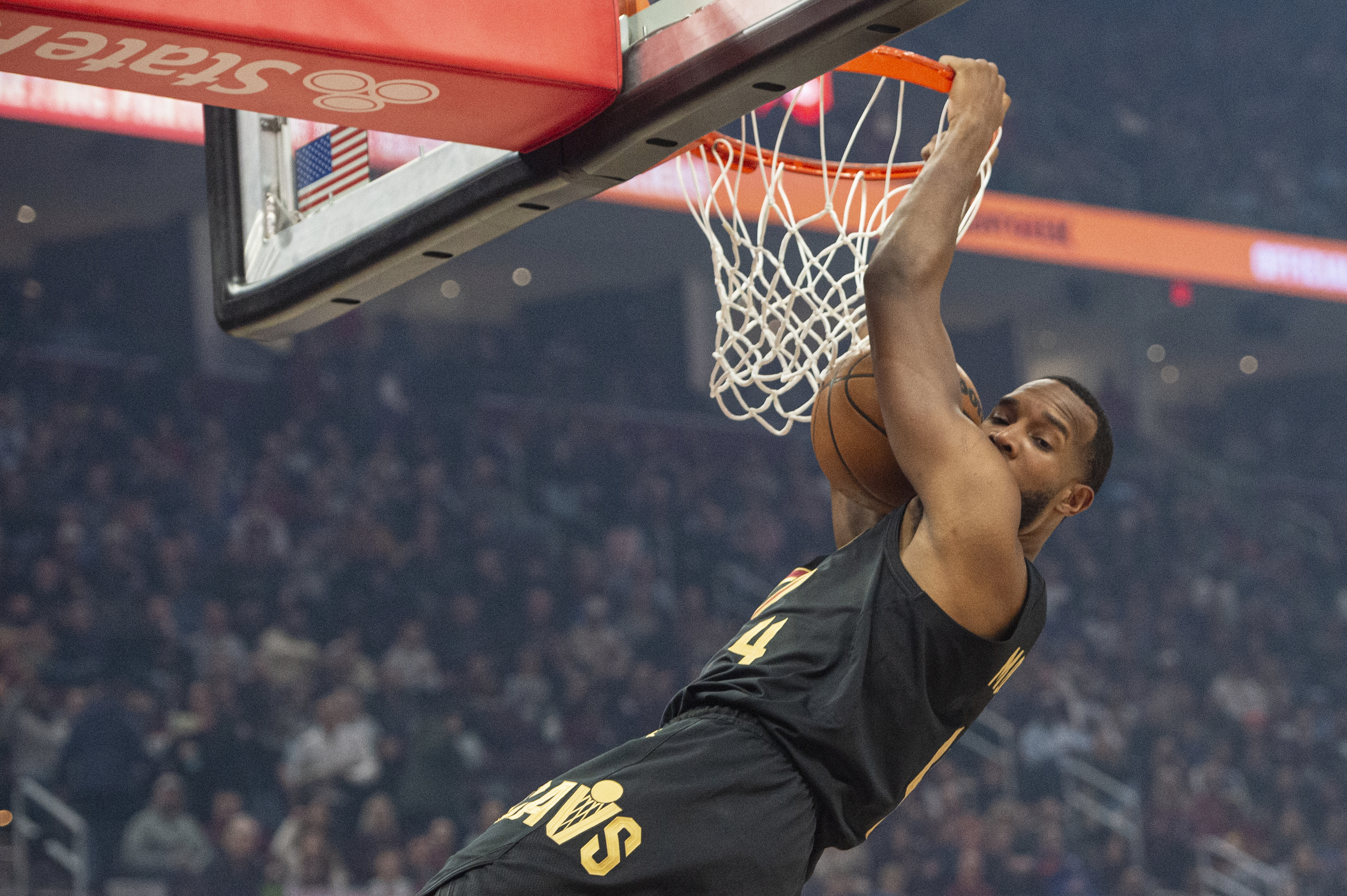Cleveland Cavaliers' Evan Mobley (4) dunks against the New York Knicks during the first half of an NBA basketball game in Cleveland, Friday, Feb. 21, 2025. 