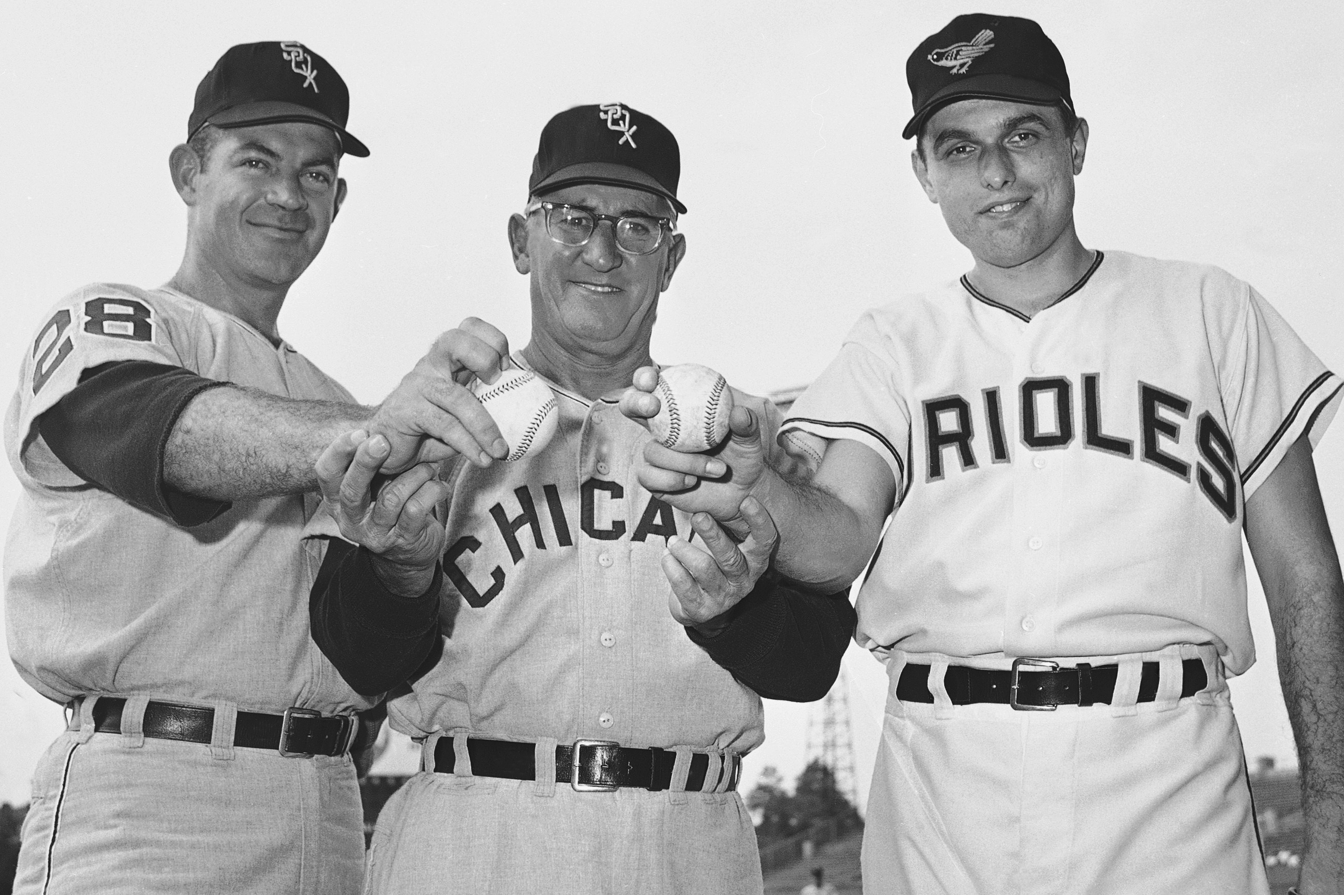 FILE - Manager Al Lopez of the Chicago White Sox, center, stands with Chicago pitcher Eddie Fisher, left, and Baltimore Orioles' Milt Pappas on July 11, 1965 in Baltimore. 