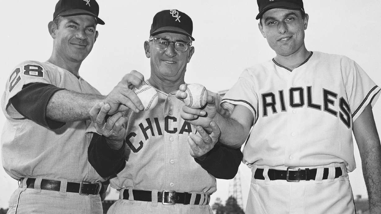 FILE - Manager Al Lopez of the Chicago White Sox, center, stands with Chicago pitcher Eddie Fisher, left, and Baltimore Orioles' Milt Pappas on July 11, 1965 in Baltimore.