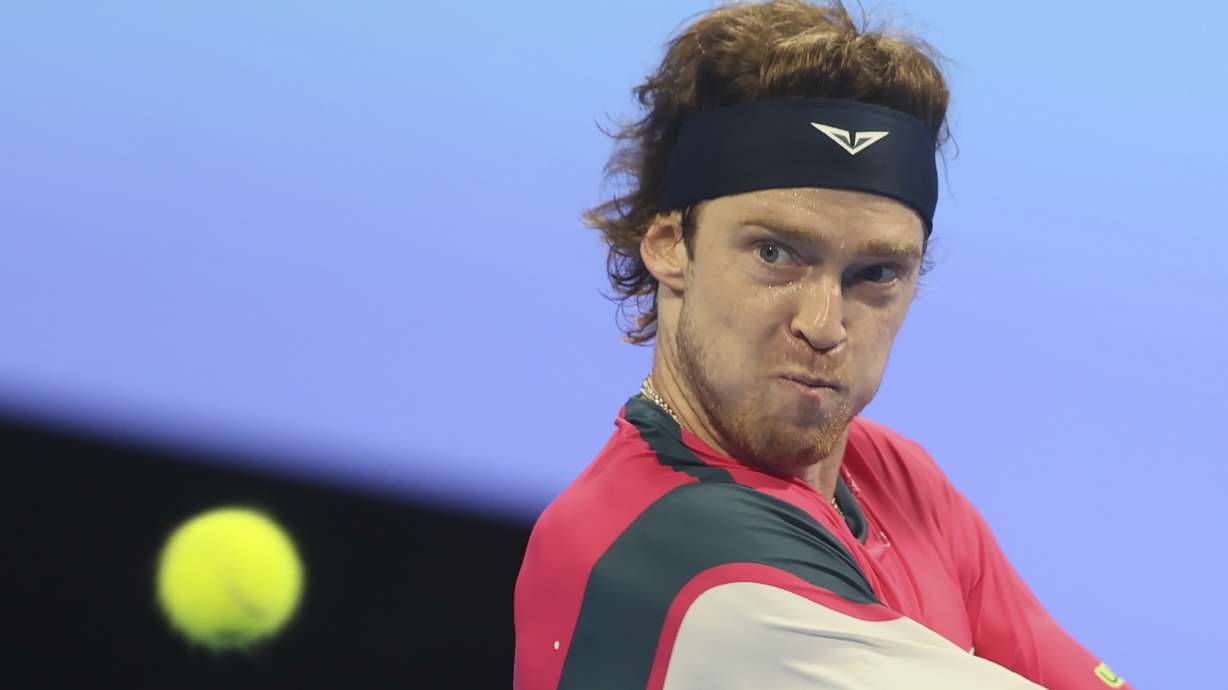 Russia's Andrey Rublev plays a shot against Britain's Jack Draper during the final match of the Qatar Open tennis tournament in Doha, Qatar, Saturday, Feb. 22, 2025.