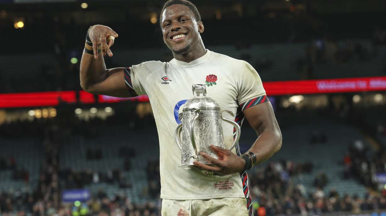 England's Maro Itoje celebrates with the Calcutta Cup after winning the Six Nations rugby union match between England and Scotland at Twickenham in London, Saturday, Feb. 22, 2025.